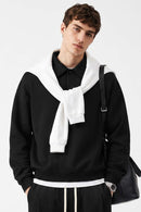 Heavyweight Long-Sleeve Polo Shirt in Black - front modeled view