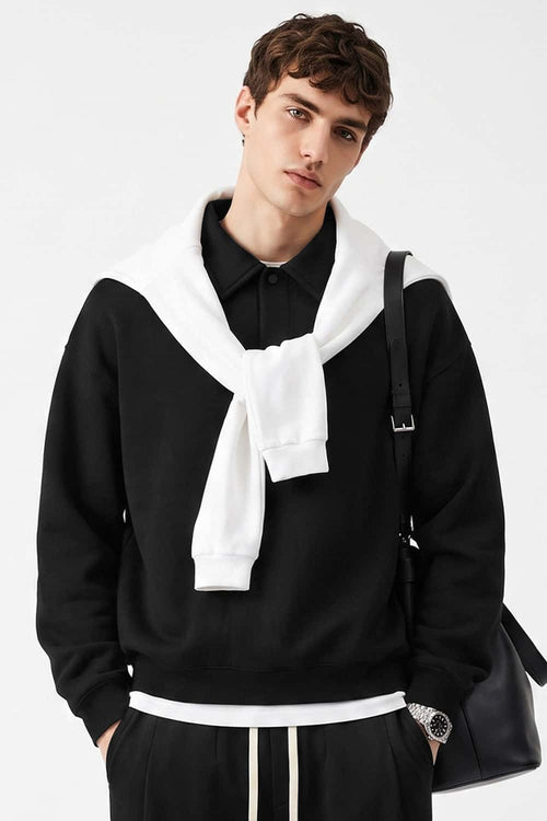 Heavyweight Long-Sleeve Polo Shirt in Black - front modeled view