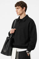 Heavyweight Long-Sleeve Polo Shirt in Black - side modeled view
