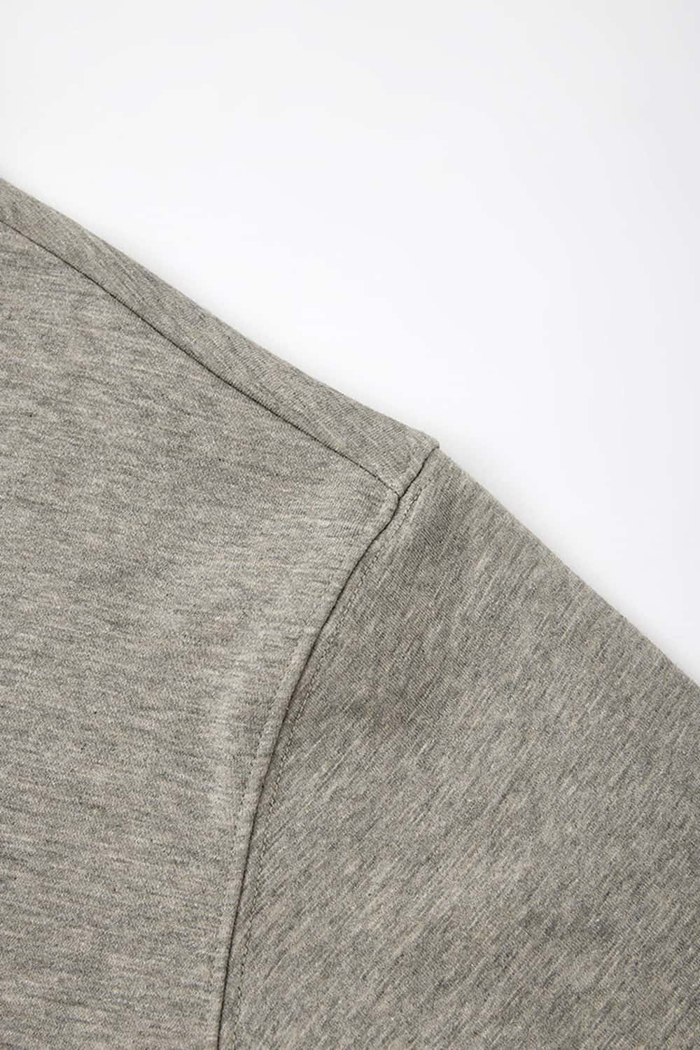 Heavyweight Long-Sleeve Polo Shirt in Oat Gray - side modeled view