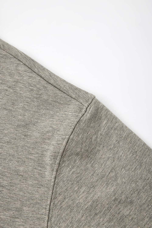 Heavyweight Long-Sleeve Polo Shirt in Oat Gray - side modeled view