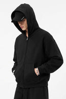 Heavyweight Boxy Zip-Up Hoodie in Black - three-quarter front modeled view