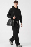 Relaxed Pullover Hoodie in Black - full-length front modeled view