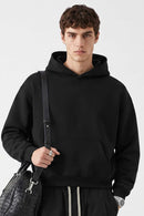 Relaxed Pullover Hoodie in Black - front modeled view
