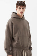 Relaxed Pullover Hoodie in Coffee - three-quarter front modeled view