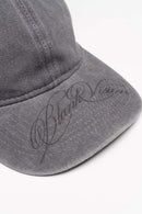 Six-Panel Cotton Baseball Cap with Cursive Artwork on the Brim in Light Gray - product detail close-up