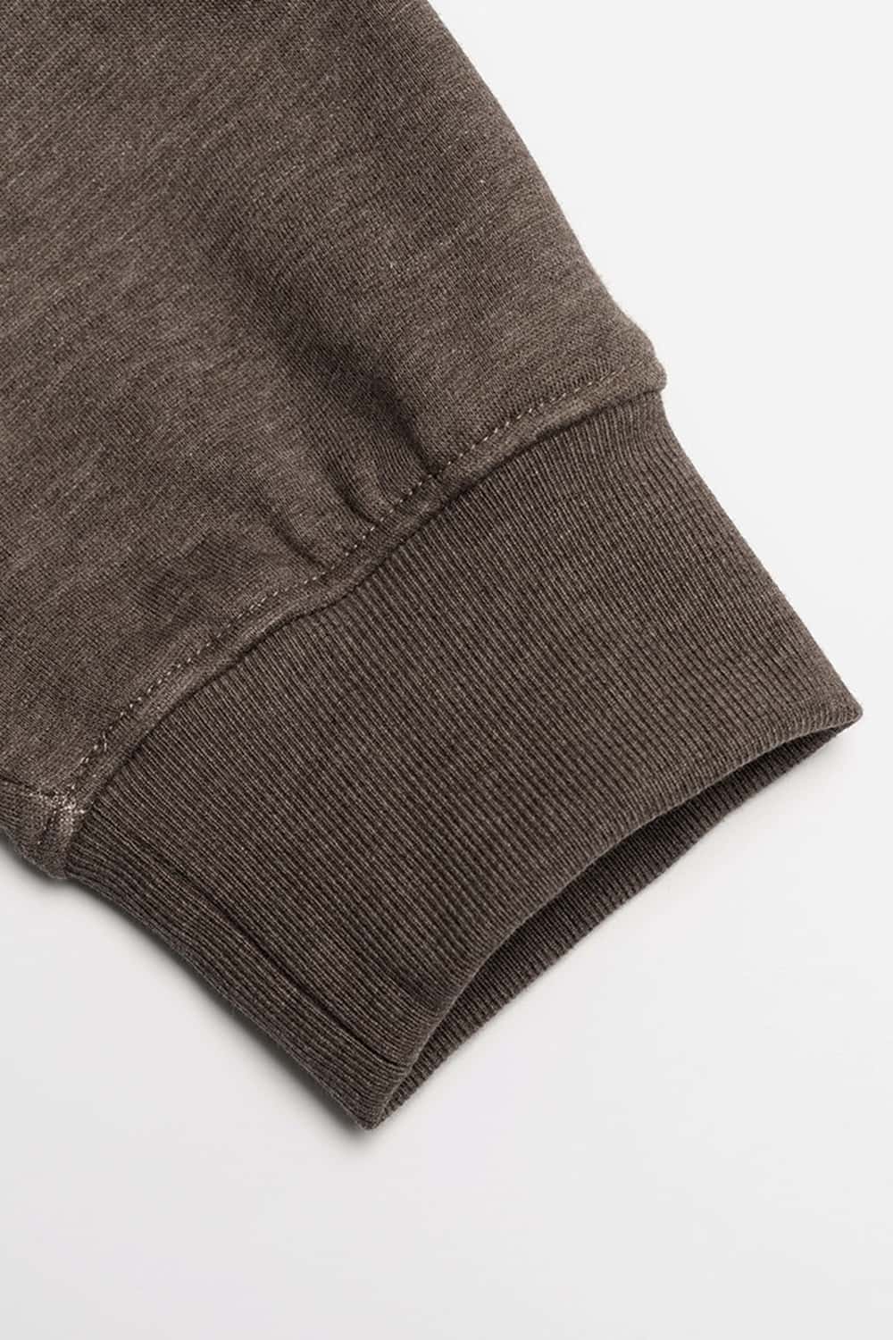 Relaxed Pullover Hoodie with Embroidered Emblem in Coffee - cuff detail