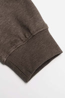 Relaxed Pullover Hoodie with Embroidered Emblem in Coffee - cuff detail