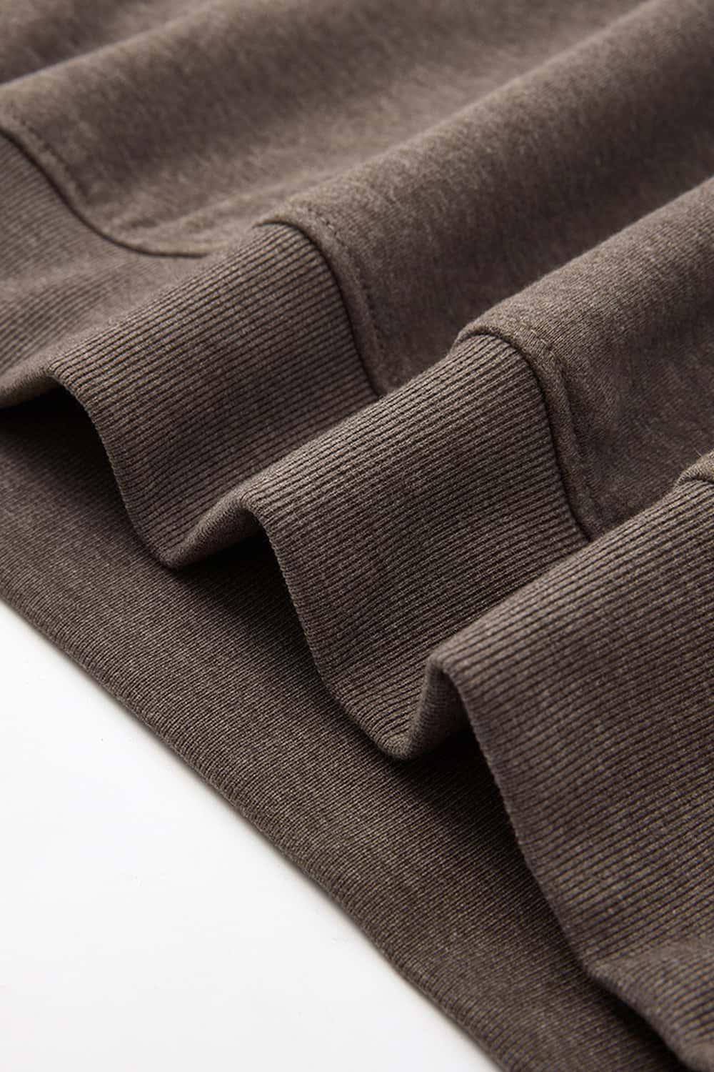 Relaxed Pullover Hoodie with Embroidered Emblem in Coffee - product detail close-up