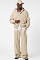 Heavyweight Two-Way Zip Hoodie with Embroidered Emblem in Apricot - full-length front modeled view