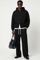 Heavyweight Two-Way Zip Hoodie with Embroidered Emblem in Black - full-length front modeled view