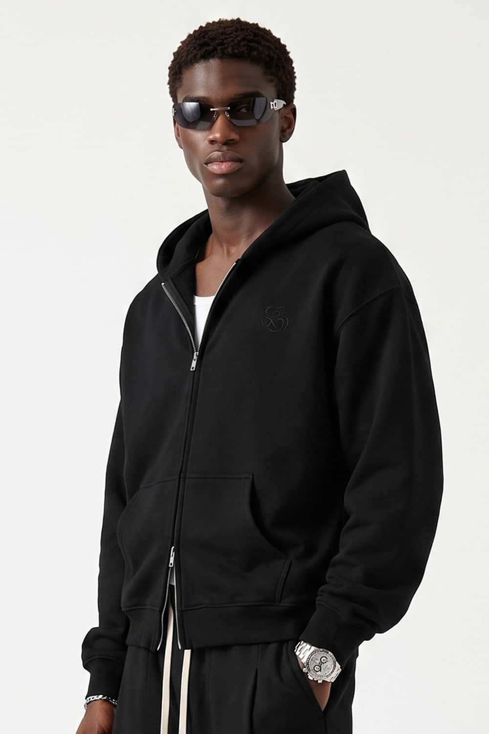 Heavyweight Two-Way Zip Hoodie with Embroidered Emblem in Black - three-quarter front modeled view