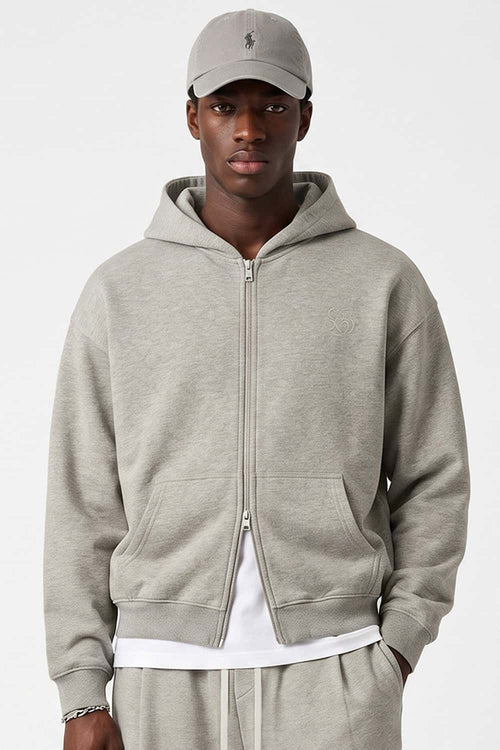 Heavyweight Two-Way Zip Hoodie with Embroidered Emblem in Oat Gray - front modeled close-up